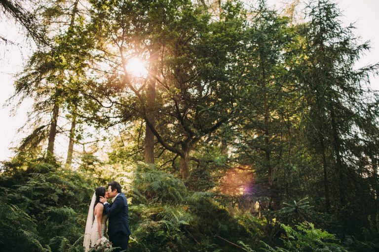Wedding portrait in the forest by Gilpin Lake House