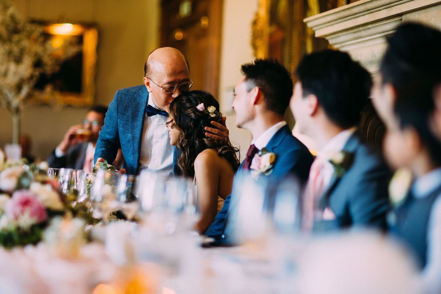 Dad kissing the bride on the head